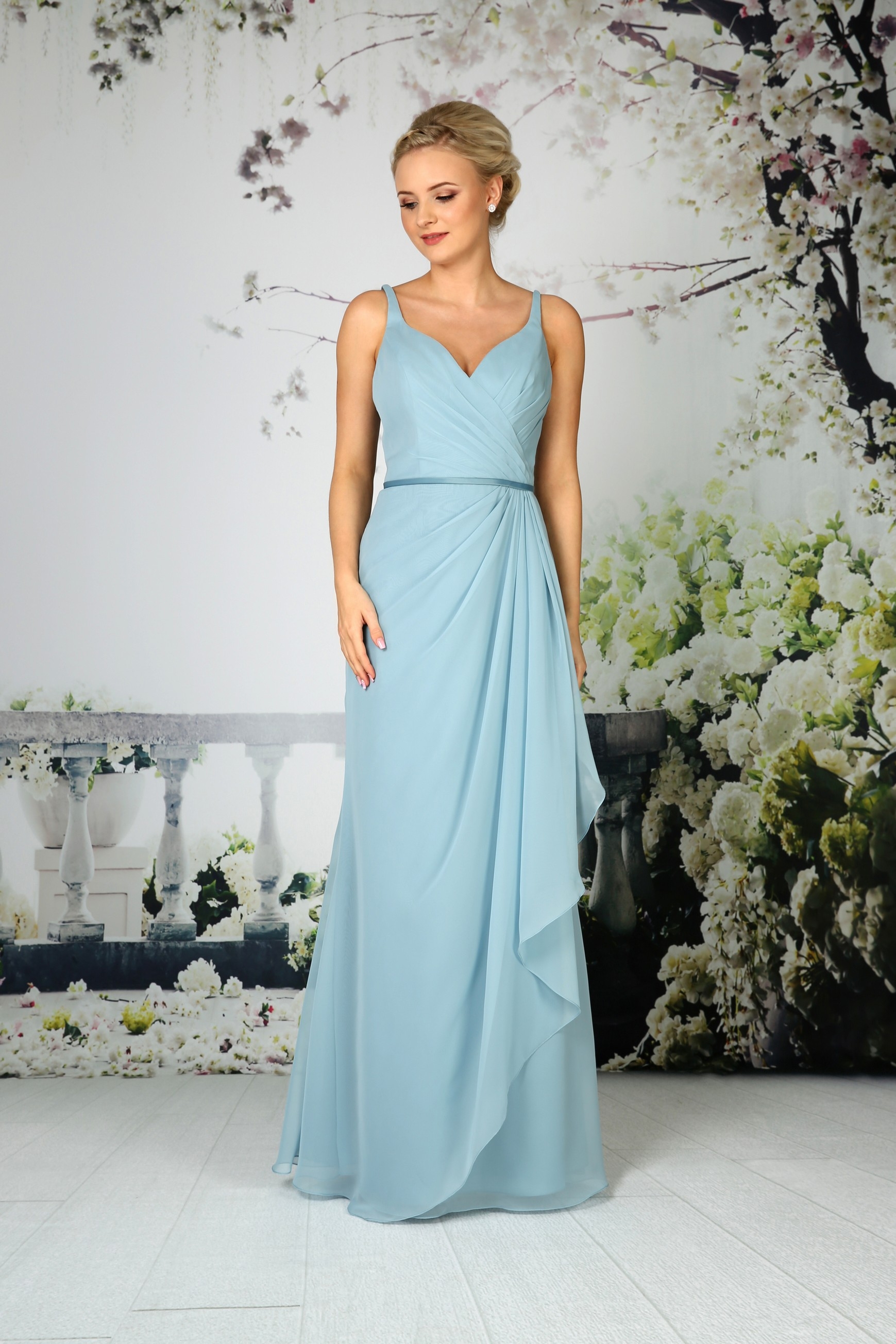 EB7562 - Feminine chiffon gown with delicate asymmetrical front pleated bodice and waterfall overlay detail to skirt